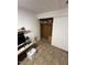 Home office with tiled floors, a work desk, and a closet at 9501 E Broadway Rd # 221, Mesa, AZ 85208