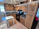 Well-equipped kitchen with ample cabinetry and a butcher block island at 9501 E Broadway Rd # 221, Mesa, AZ 85208