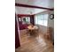 Charming dining area with wood table and chairs, and red cabinetry at 9501 E Broadway Rd # 221, Mesa, AZ 85208