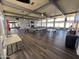 Large community room with tables and fireplace at 9501 E Broadway Rd # 221, Mesa, AZ 85208