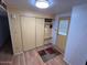 Inviting entryway with built-in storage and wood floors at 9501 E Broadway Rd # 221, Mesa, AZ 85208