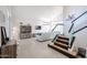 Bright and spacious living room with high ceilings and modern staircase at 17511 N Kimberly Way, Surprise, AZ 85374
