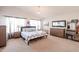 Main bedroom suite with a large bed and plenty of dresser space at 17511 N Kimberly Way, Surprise, AZ 85374