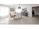 Bright dining room with hardwood floors and a view to the kitchen at 17511 N Kimberly Way, Surprise, AZ 85374