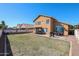 Large backyard with grassy area, patio, and grill at 17511 N Kimberly Way, Surprise, AZ 85374