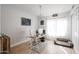 Home office features a glass-top desk, comfortable chair and built in shelving at 17511 N Kimberly Way, Surprise, AZ 85374