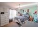 Light and airy bedroom with a queen bed and stylish decor at 17511 N Kimberly Way, Surprise, AZ 85374