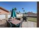 Patio with table, chairs, and umbrella at 17511 N Kimberly Way, Surprise, AZ 85374