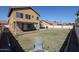 Spacious backyard with grassy area and patio furniture at 17511 N Kimberly Way, Surprise, AZ 85374