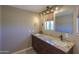 Bathroom with granite double vanity and updated fixtures at 30240 N 60Th St, Cave Creek, AZ 85331