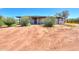 Front view of the house with desert landscaping at 30240 N 60Th St, Cave Creek, AZ 85331