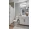 Clean bathroom with white vanity, shower, and tile floor at 1859 N Westfall Ln, Casa Grande, AZ 85122