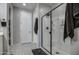 Modern bathroom with a large glass shower and grey tile floors at 1859 N Westfall Ln, Casa Grande, AZ 85122