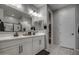 Stylish bathroom with double vanity and modern lighting fixtures at 1859 N Westfall Ln, Casa Grande, AZ 85122