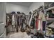 Large walk-in closet with ample hanging space and shelving at 1859 N Westfall Ln, Casa Grande, AZ 85122