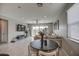Open concept dining area with a round table and seating for four at 1859 N Westfall Ln, Casa Grande, AZ 85122