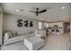 Spacious living room with sectional sofa and access to backyard at 1859 N Westfall Ln, Casa Grande, AZ 85122