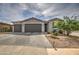Two-story home with a two-car garage and paver driveway at 1859 N Westfall Ln, Casa Grande, AZ 85122