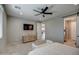Bright bedroom featuring a ceiling fan and built-in wardrobe at 1859 N Westfall Ln, Casa Grande, AZ 85122