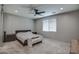 Large bedroom with a king-size bed and plenty of natural light at 1859 N Westfall Ln, Casa Grande, AZ 85122