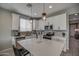 Modern kitchen with white shaker cabinets and large island at 1859 N Westfall Ln, Casa Grande, AZ 85122