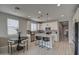 Modern kitchen with white cabinets, quartz countertops, and island at 1859 N Westfall Ln, Casa Grande, AZ 85122