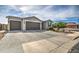 Two-story home with a two-car garage and paver driveway at 1859 N Westfall Ln, Casa Grande, AZ 85122