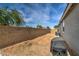 Large backyard with block wall and covered patio at 1859 N Westfall Ln, Casa Grande, AZ 85122