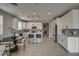 Open kitchen with island, stainless steel appliances, and white cabinetry at 1859 N Westfall Ln, Casa Grande, AZ 85122