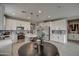 Modern kitchen with white cabinets and a large island at 1859 N Westfall Ln, Casa Grande, AZ 85122