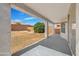 Covered patio overlooking a backyard with desert landscaping at 11168 E Lost Canyon Ct, Gold Canyon, AZ 85118