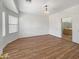 Bright bedroom with wood-look floors and an ensuite bathroom at 11168 E Lost Canyon Ct, Gold Canyon, AZ 85118