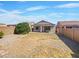 Large backyard with gravel and a covered patio at 11168 E Lost Canyon Ct, Gold Canyon, AZ 85118