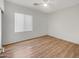 Bright bedroom with wood-look floors and window blinds at 11168 E Lost Canyon Ct, Gold Canyon, AZ 85118