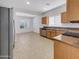 Kitchen with wood cabinets, granite counters, and stainless steel appliances at 11168 E Lost Canyon Ct, Gold Canyon, AZ 85118