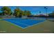 Two blue tennis courts with nets and surrounding fencing at 14300 W Bell Rd # 505, Surprise, AZ 85374
