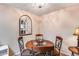 Small dining area with a round table and three chairs at 14300 W Bell Rd # 505, Surprise, AZ 85374
