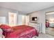 Spacious bedroom with a dresser and mirrored closet doors at 14300 W Bell Rd # 505, Surprise, AZ 85374