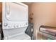 Convenient laundry room with stackable washer and dryer at 14300 W Bell Rd # 505, Surprise, AZ 85374