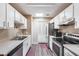 Well-equipped kitchen featuring stainless steel appliances and white cabinetry at 14300 W Bell Rd # 505, Surprise, AZ 85374