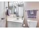 Bright bathroom featuring a vanity with a large mirror at 14300 W Bell Rd # 505, Surprise, AZ 85374