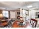 Bright dining area with wood table and four chairs, adjacent to kitchen and living room at 14300 W Bell Rd # 505, Surprise, AZ 85374