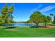 Serene lake with fountain and lush landscaping at 14300 W Bell Rd # 505, Surprise, AZ 85374