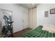 Bedroom with a bed, exercise bike, and closet at 16194 W Jefferson St, Goodyear, AZ 85338