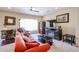 Living room with fireplace and ample natural light at 16222 W Talara Way, Surprise, AZ 85374