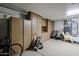 Organized garage with built-in cabinets and storage at 16222 W Talara Way, Surprise, AZ 85374