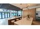 Open kitchen with island seating and living room views at 4350 N Jokake Dr, Scottsdale, AZ 85251