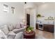 Relaxing living room with a wet bar and comfortable seating at 11796 W Creosote Dr, Peoria, AZ 85383