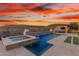 Resort-style backyard with a large pool, spa, and outdoor kitchen at 11796 W Creosote Dr, Peoria, AZ 85383