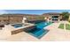 Luxury pool and spa with a built-in outdoor bar at 11796 W Creosote Dr, Peoria, AZ 85383